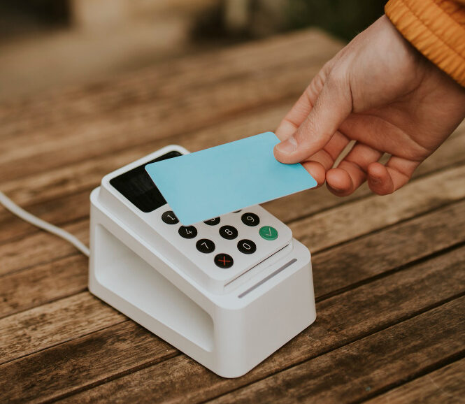 Card reader being used by customer